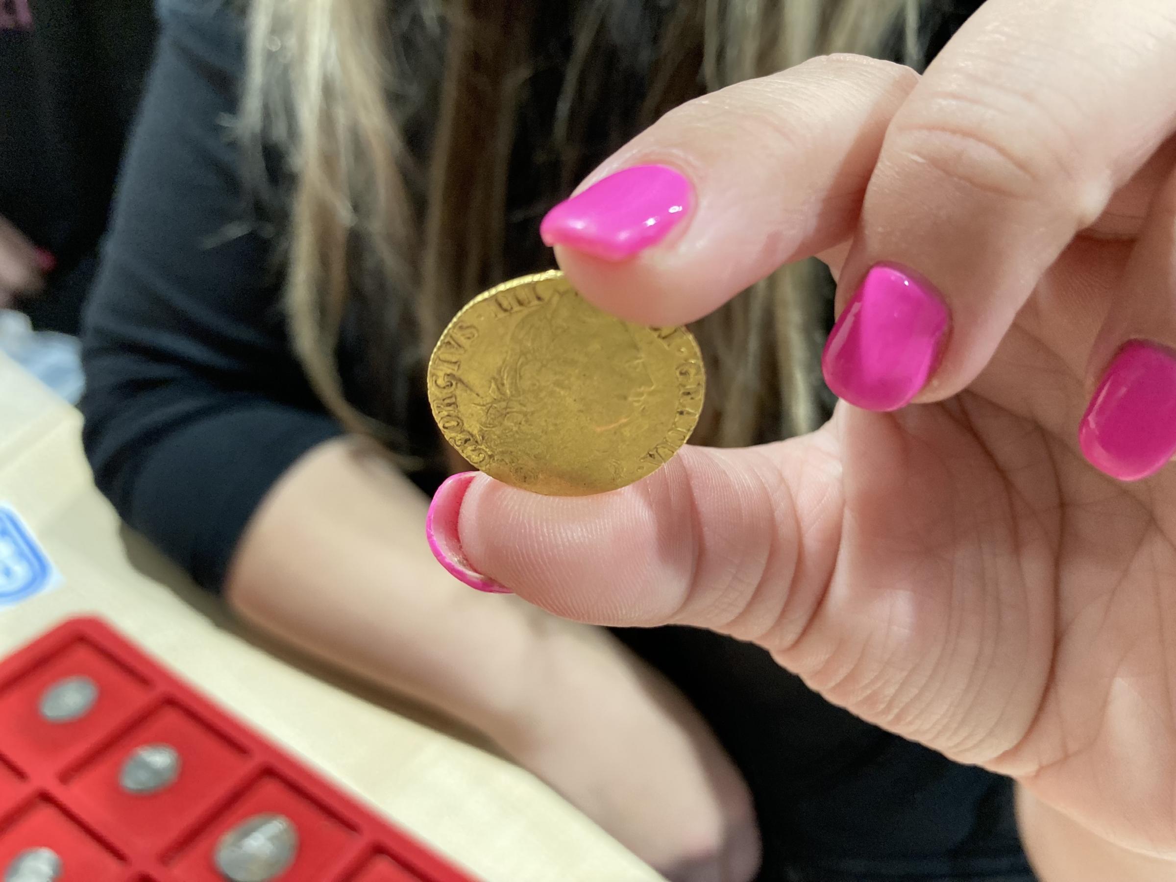 One of the \Soil Sisters\ - You Tuber metal detectorist Sam Moss with her gold guinea coin Image Dale Spridgeon