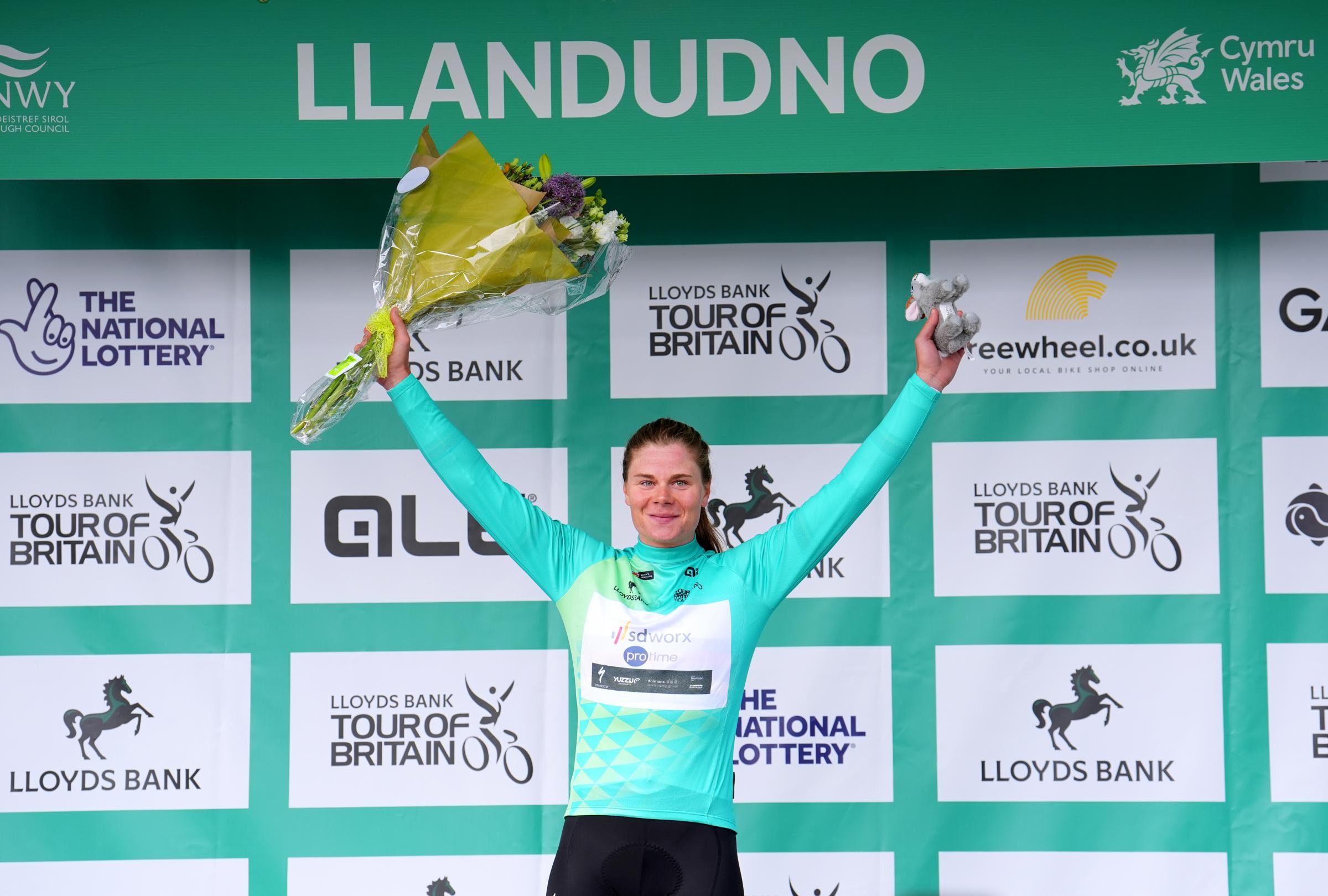 Lotte Kopecky of team SD-Worx - Protim on the podium in the Race Leader jersey after winning stage one of the Lloyds Bank Women Tour of Britain 2024 from Welshpool to Llandudno. Picture date: Thursday June 6, 2024. PA Photo. See PA story CYCLING Womens